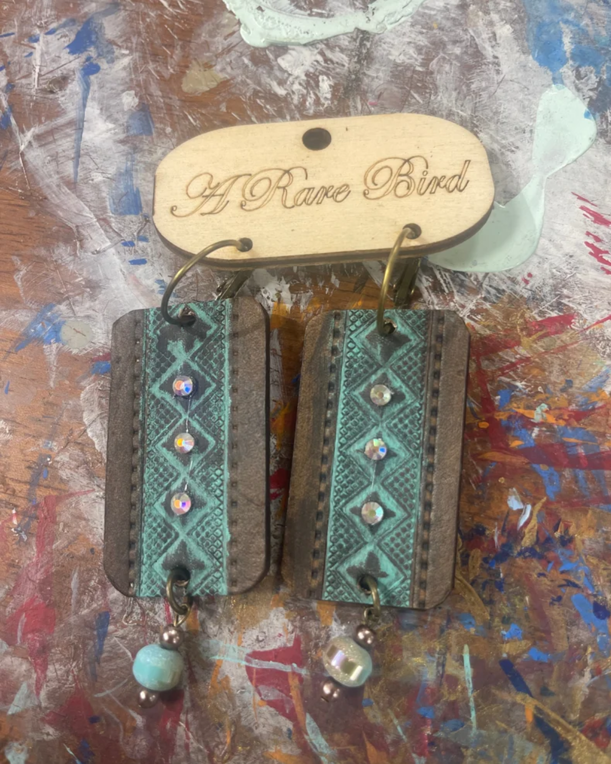 Hand tooled Leather Earring with Bead